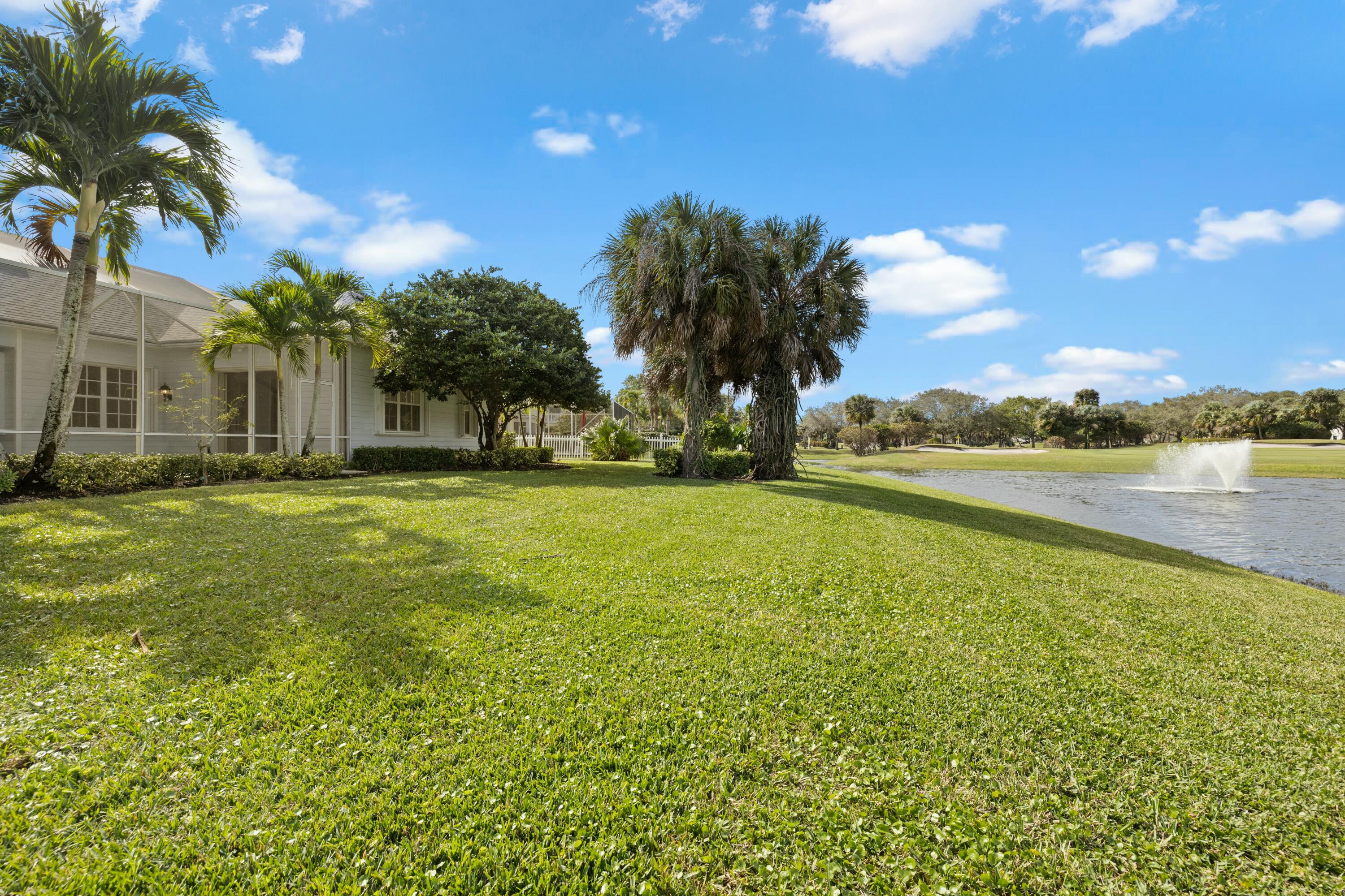 140 Barbados Drive Jupiter, FL 33458 - Photo 11 of 42 a view of a lake with houses