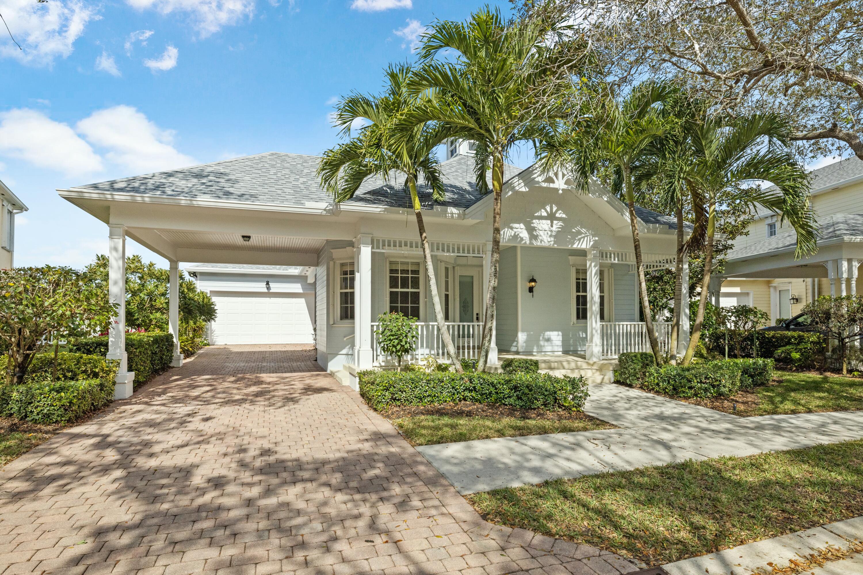 140 Barbados Drive Jupiter, FL 33458 - Photo 28 of 42 a front view of a house with garden
