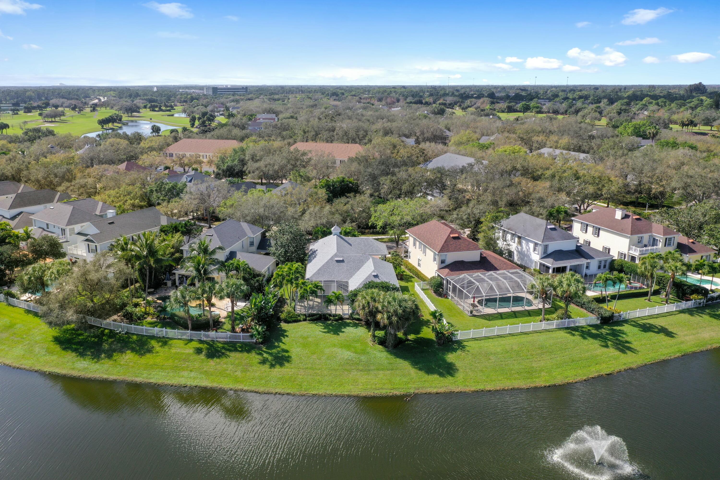 140 Barbados Drive Jupiter, FL 33458 - Photo 29 of 42 an aerial view of residential houses with outdoor space and lake view