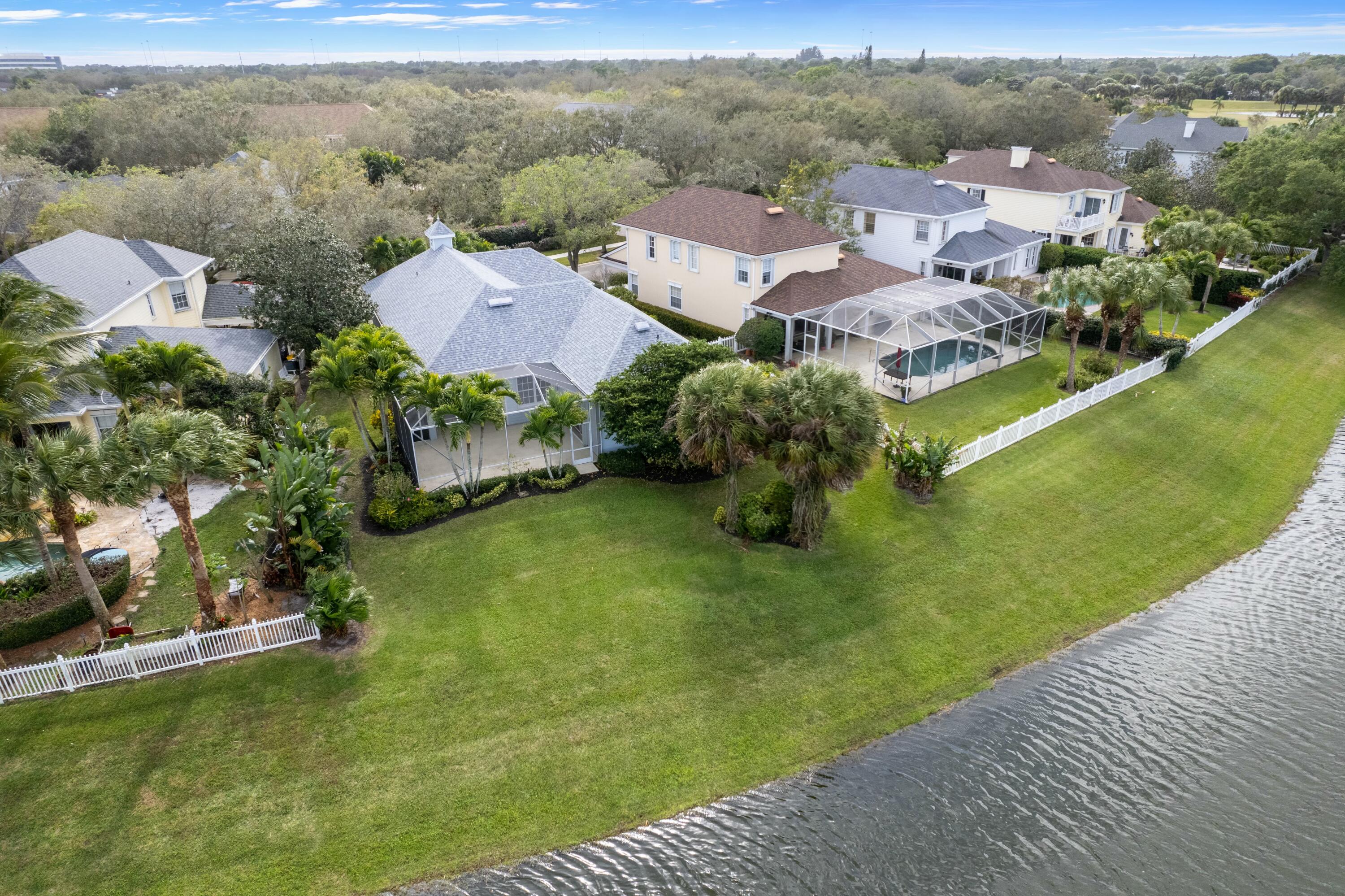 140 Barbados Drive Jupiter, FL 33458 - Photo 31 of 42 an aerial view of residential houses with outdoor space and trees