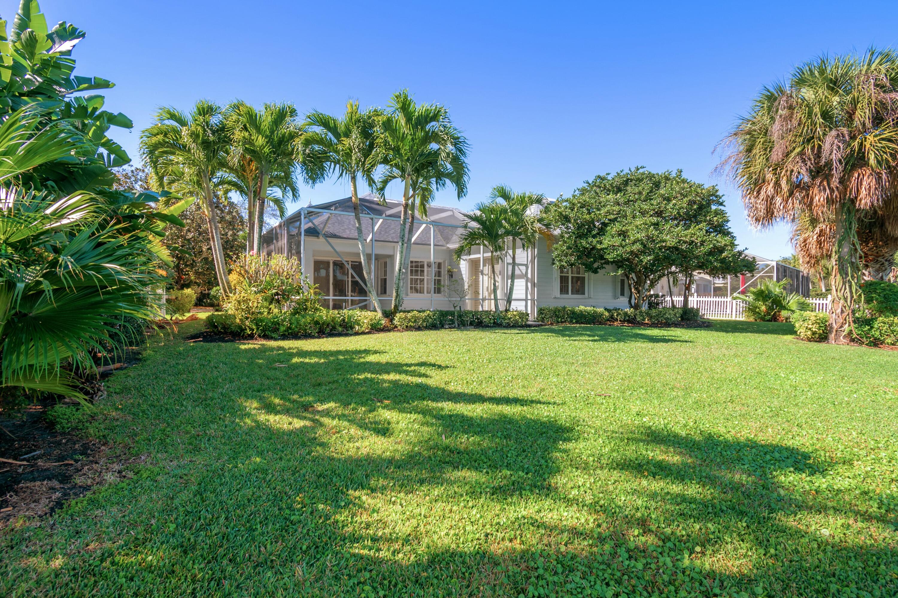 140 Barbados Drive Jupiter, FL 33458 - Photo 42 of 42 a front view of a house with a yard