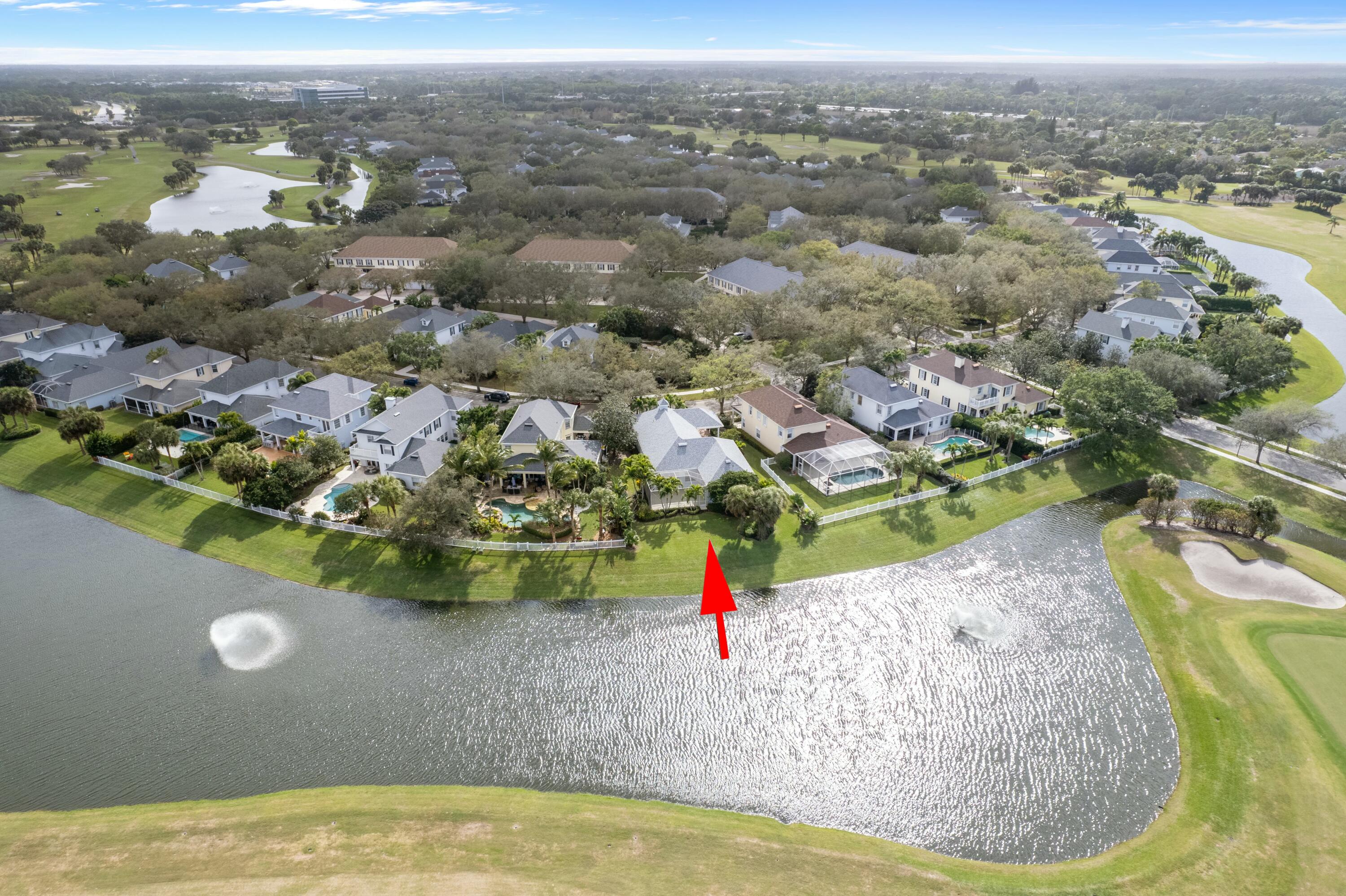 140 Barbados Drive Jupiter, FL 33458 - Photo 8 of 42 an aerial view of a house with a yard and lake view