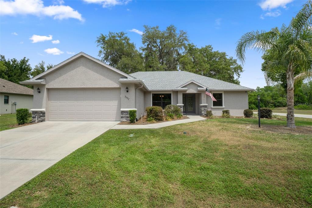 2797 North Hythe Point Hernando, FL 34442 - Photo 1 of 1 a front view of a house with yard patio and green space