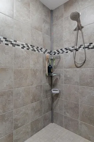 a bathroom with a bathtub and shower
