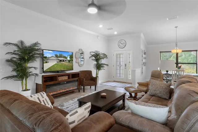 a kitchen with a sink a counter top space appliances and cabinets