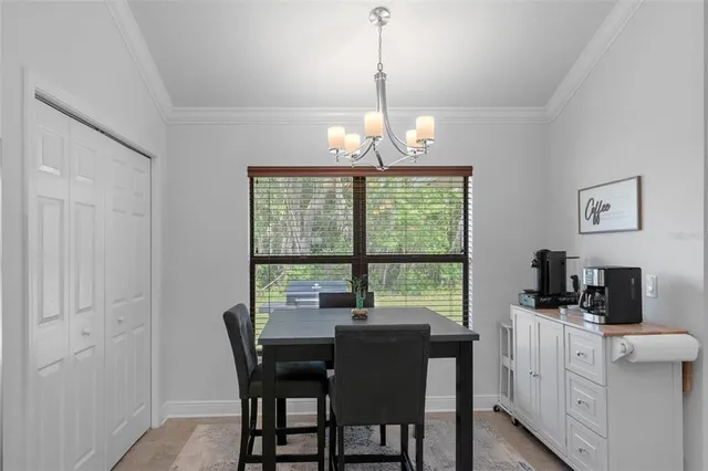 a kitchen with stainless steel appliances granite countertop sink stove top oven and cabinets