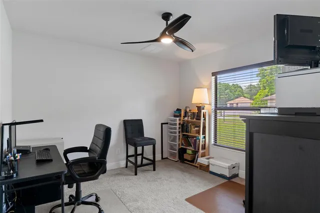 a view of a workspace with furniture and toys