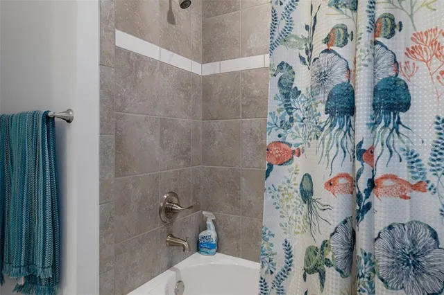 a bedroom with a bed and a chair