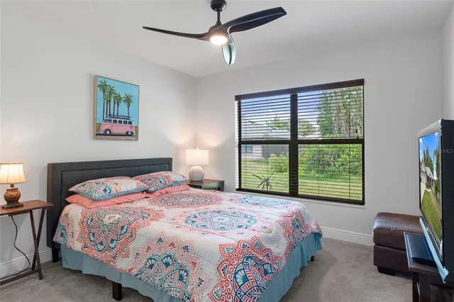 a bedroom with a bed and a lamp