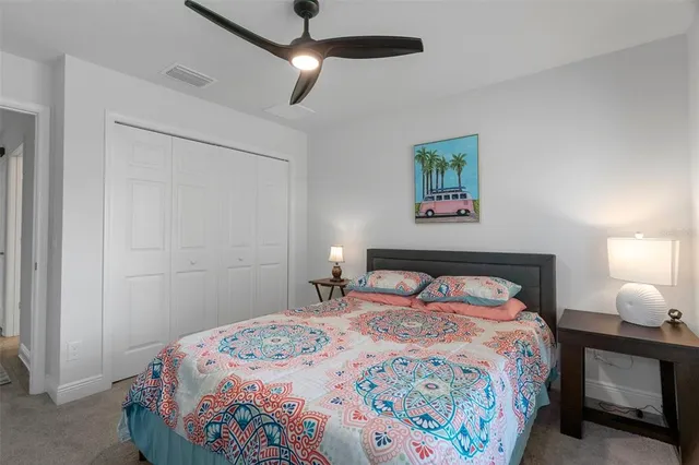 a bathroom with a granite countertop sink a toilet and a mirror