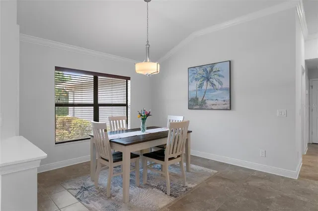 a view of a dining room with furniture window and outside view