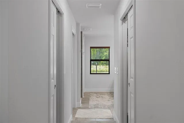a view of hallway with shower