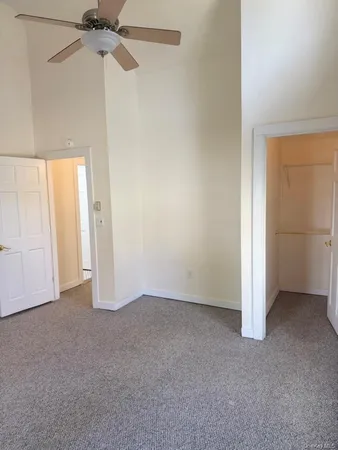 an empty room with a empty space and windows