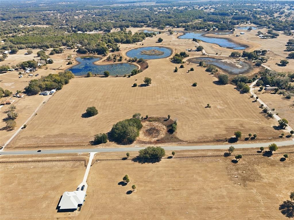Emerald Avenue Leesburg, FL 34788 - Photo 4 of 8 an aerial view of residential houses with outdoor space