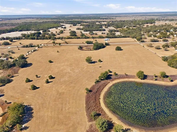 an aerial view of a house with outdoor space