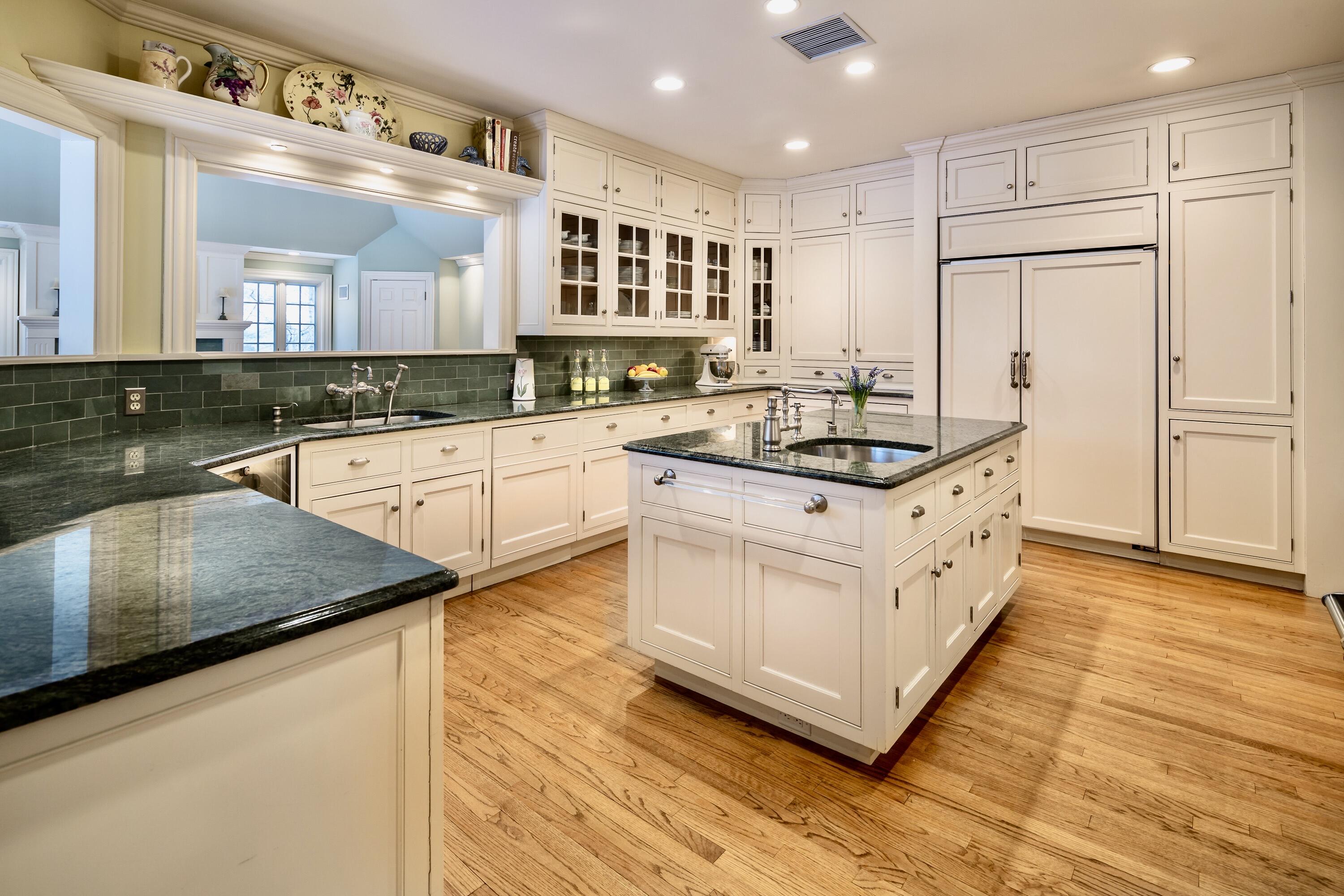 360 Greenley Road New Canaan, CT 06840 - Photo 11 of 22 a kitchen with stainless steel appliances granite countertop a stove a sink and a refrigerator