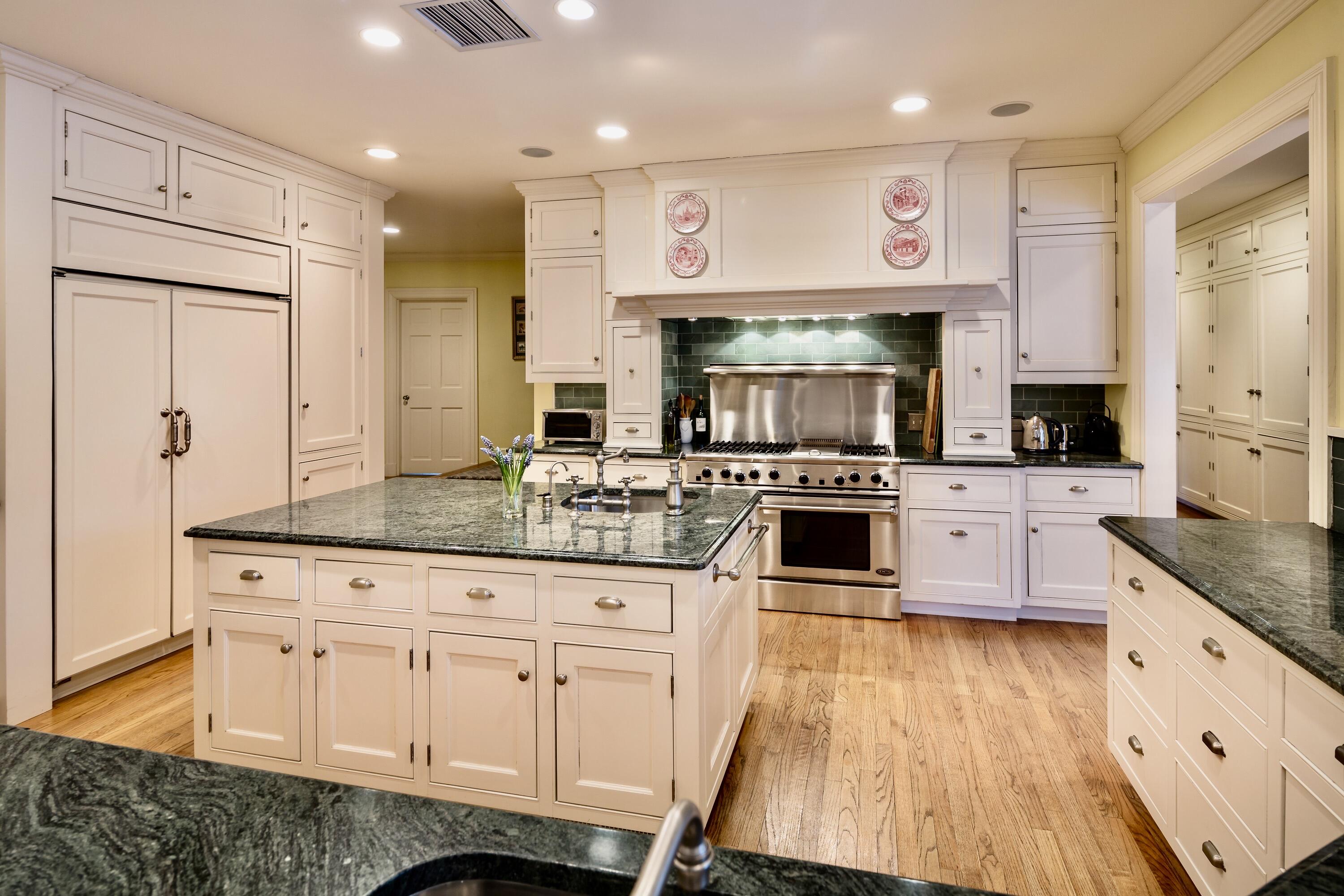 360 Greenley Road New Canaan, CT 06840 - Photo 12 of 22 a kitchen with granite countertop a sink a counter top space stainless steel appliances and cabinets