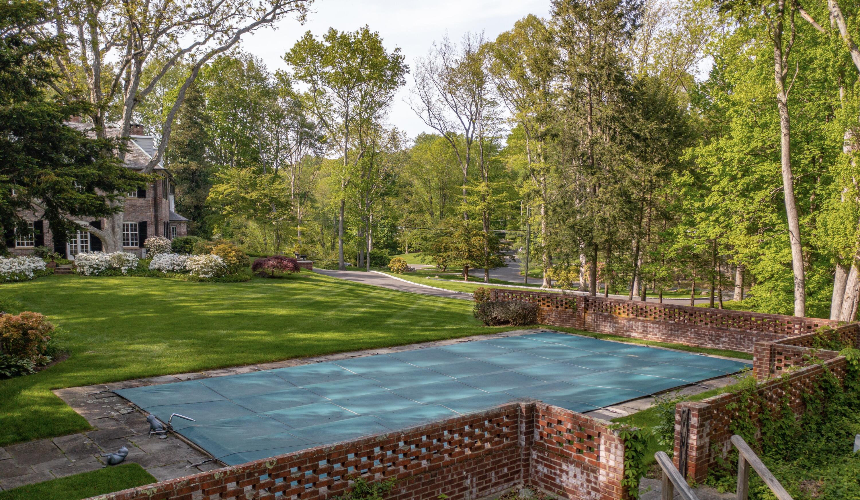 360 Greenley Road New Canaan, CT 06840 - Photo 20 of 22 a view of a backyard with a small pool