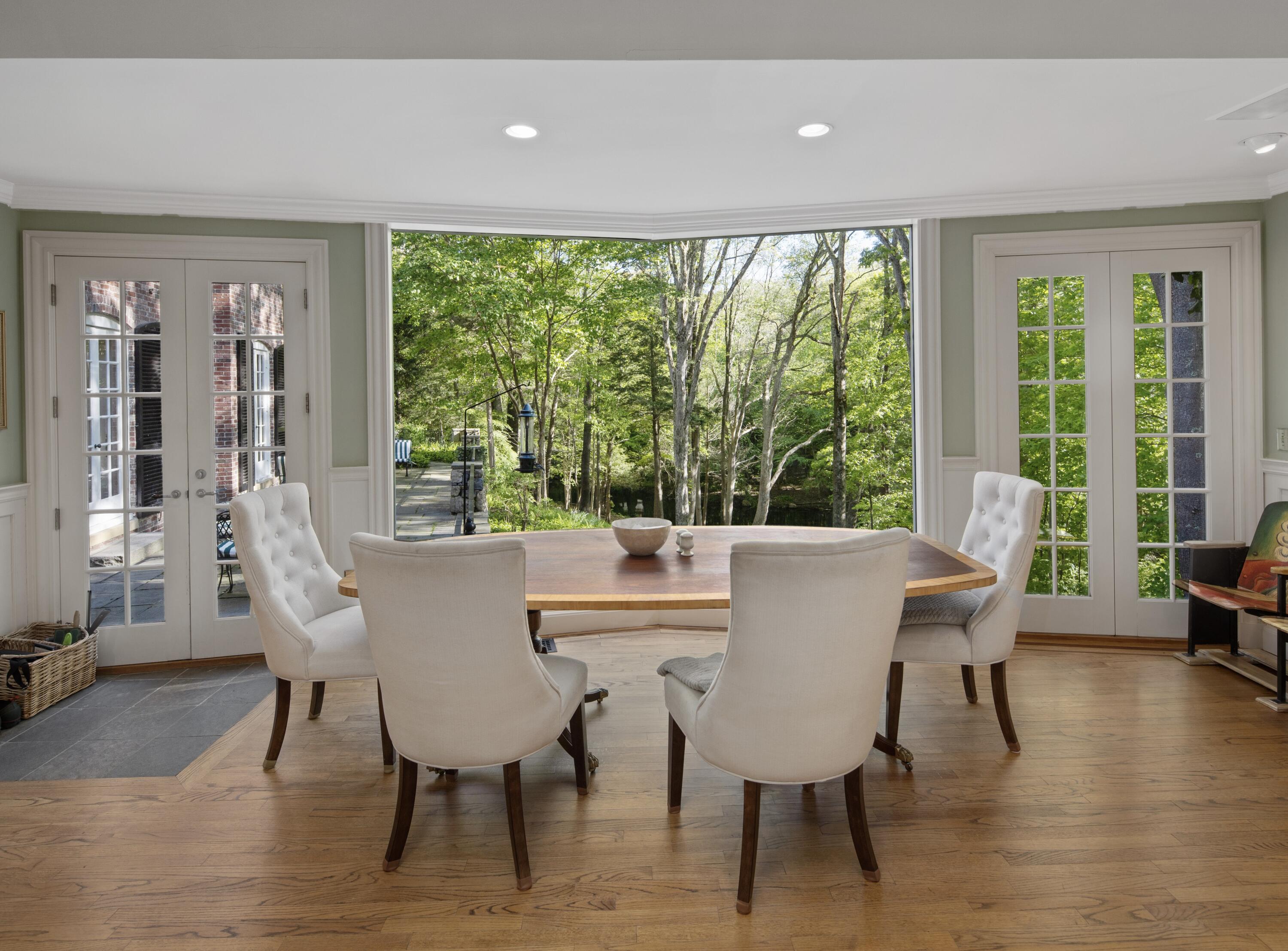 360 Greenley Road New Canaan, CT 06840 - Photo 9 of 22 a view of a dining room with furniture and wooden floor