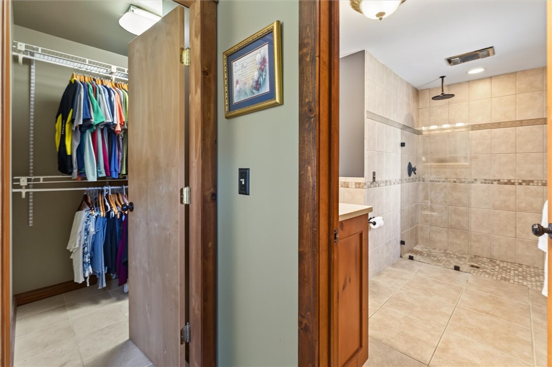 7150 Gauss Road Bloomfield, NY 14469 - Photo 20 of 50 walk-in closet and en-suite bathroom