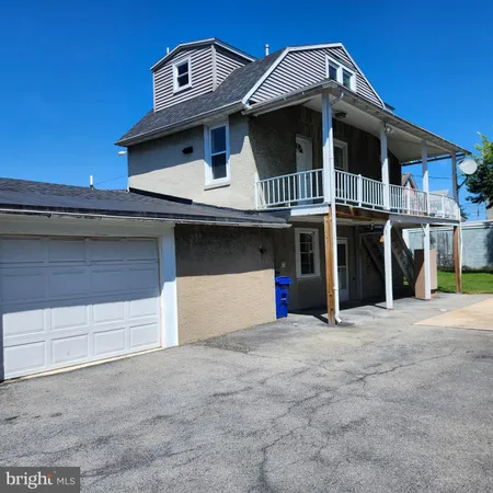 a front view of a house with garage