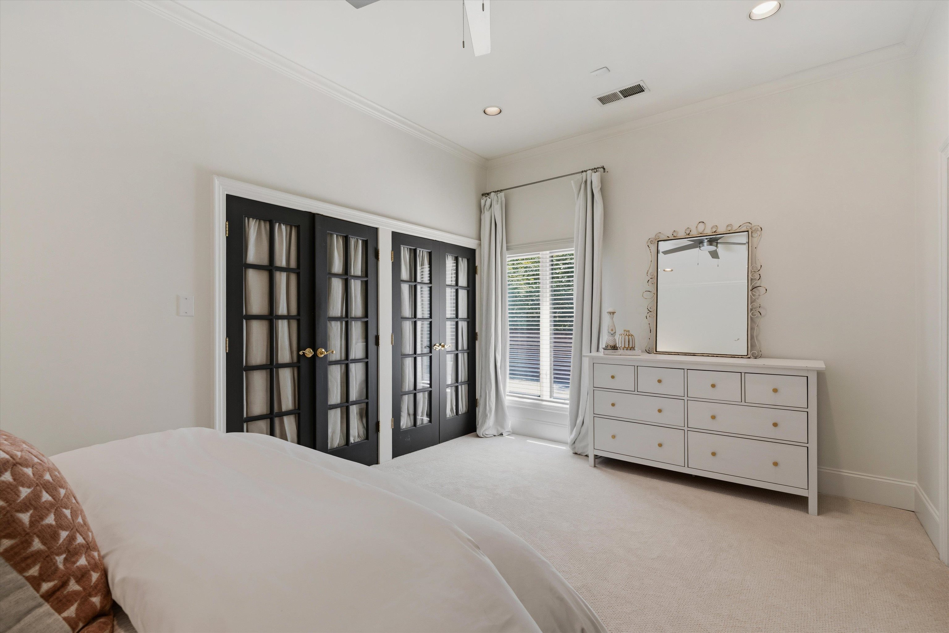 4710 Gwynne Road Memphis, TN 38117 - Photo 27 of 40 a bedroom with a bed and a dresser