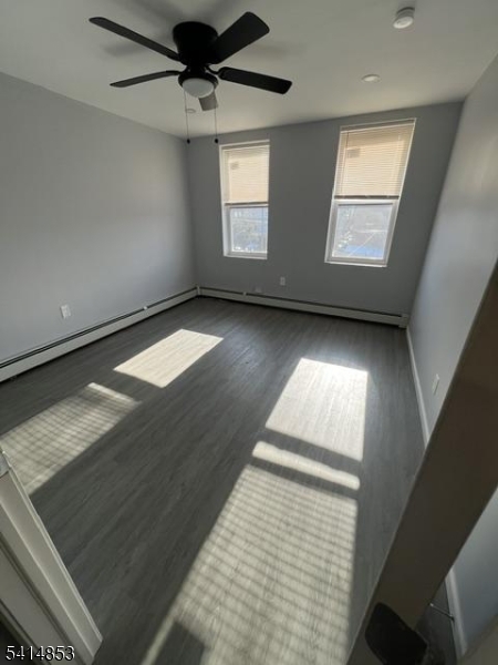 21 Alva Street, Unit 2 Bloomfield, NJ 07003 - Photo 11 of 16 a view of an empty room and window