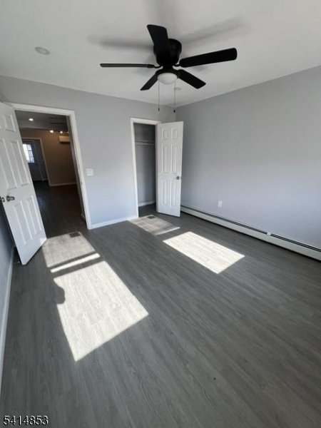 21 Alva Street, Unit 2 Bloomfield, NJ 07003 - Photo 12 of 16 a view of an empty room and wooden floor