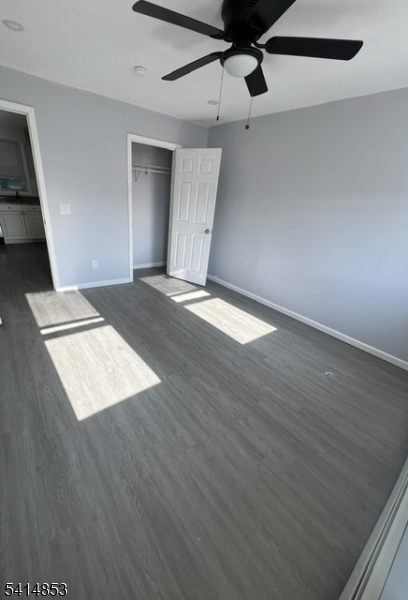 21 Alva Street, Unit 2 Bloomfield, NJ 07003 - Photo 14 of 16 a view of an empty room with wooden floor and a window