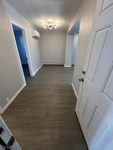 21 Alva Street, Unit 2 Bloomfield, NJ 07003 - Photo 3 of 16 a view of an empty room with wooden floor