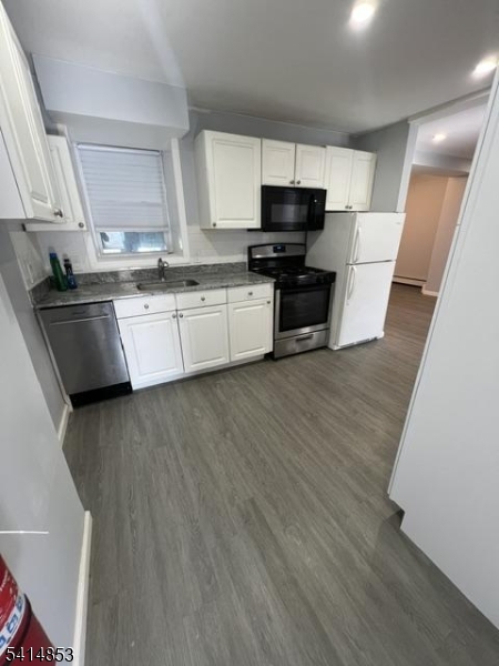 21 Alva Street, Unit 2 Bloomfield, NJ 07003 - Photo 6 of 16 a kitchen with stainless steel appliances a refrigerator sink and microwave