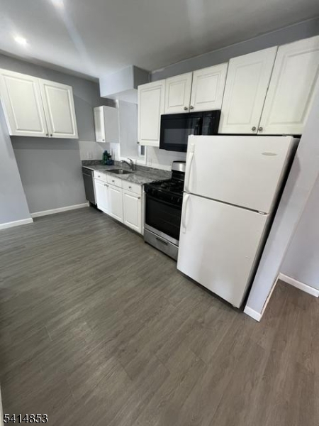 21 Alva Street, Unit 2 Bloomfield, NJ 07003 - Photo 7 of 16 a kitchen with a sink a white refrigerator and cabinets