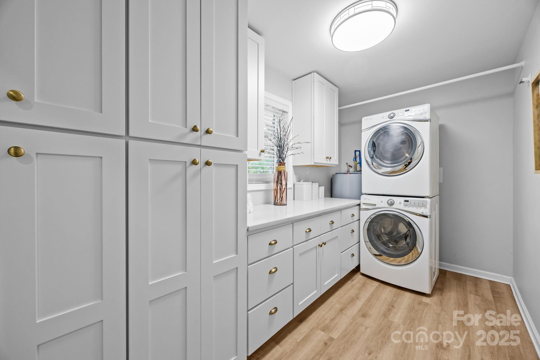 1813 Doster Road Monroe, NC 28112 - Photo 12 of 47 a view of a hallway with washer and dryer