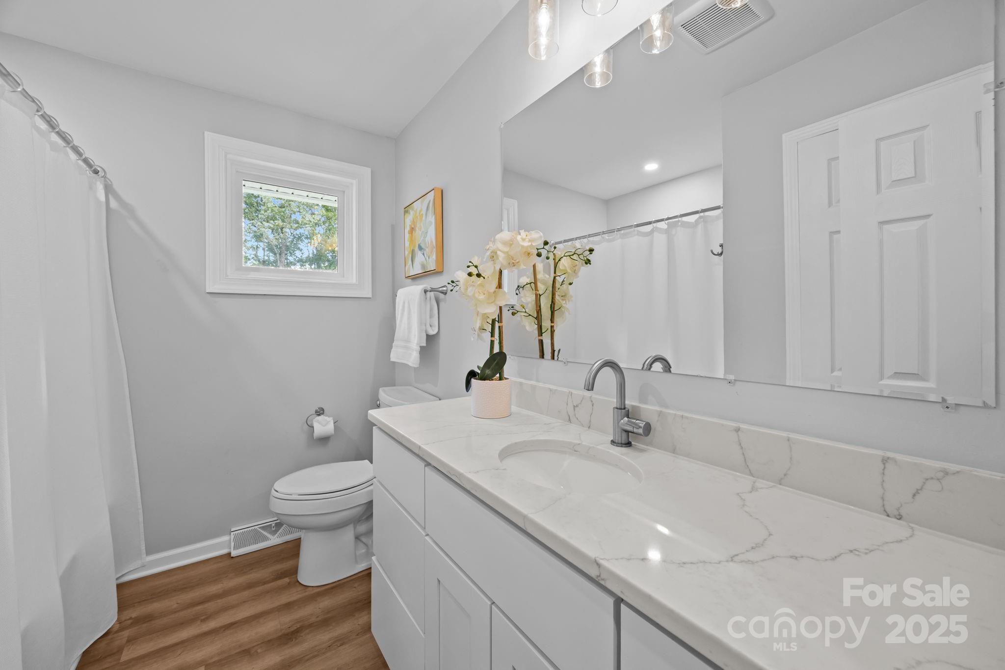 1813 Doster Road Monroe, NC 28112 - Photo 18 of 47 a bathroom with a sink toilet and shower