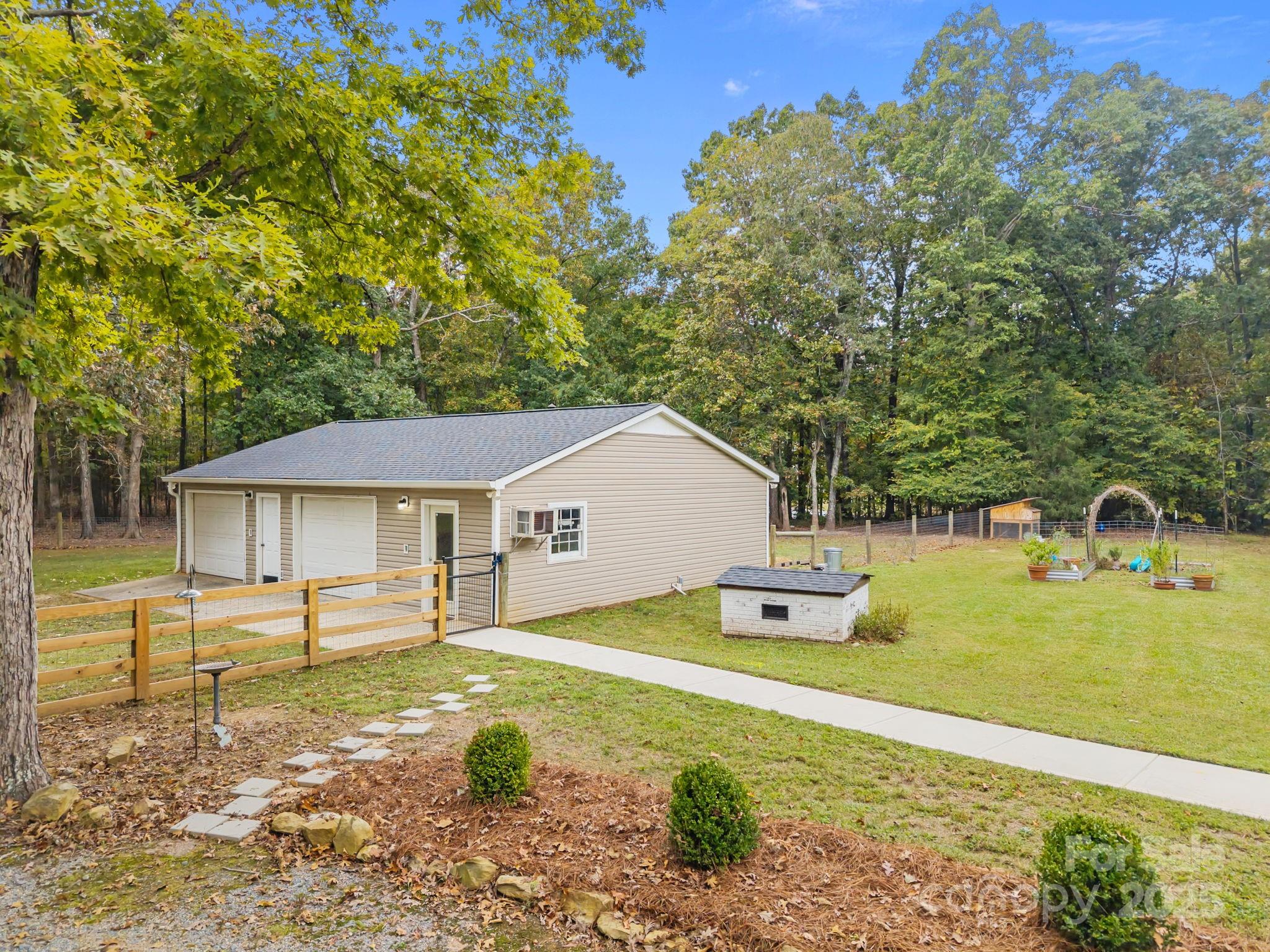1813 Doster Road Monroe, NC 28112 - Photo 32 of 47 a front view of a house with garden