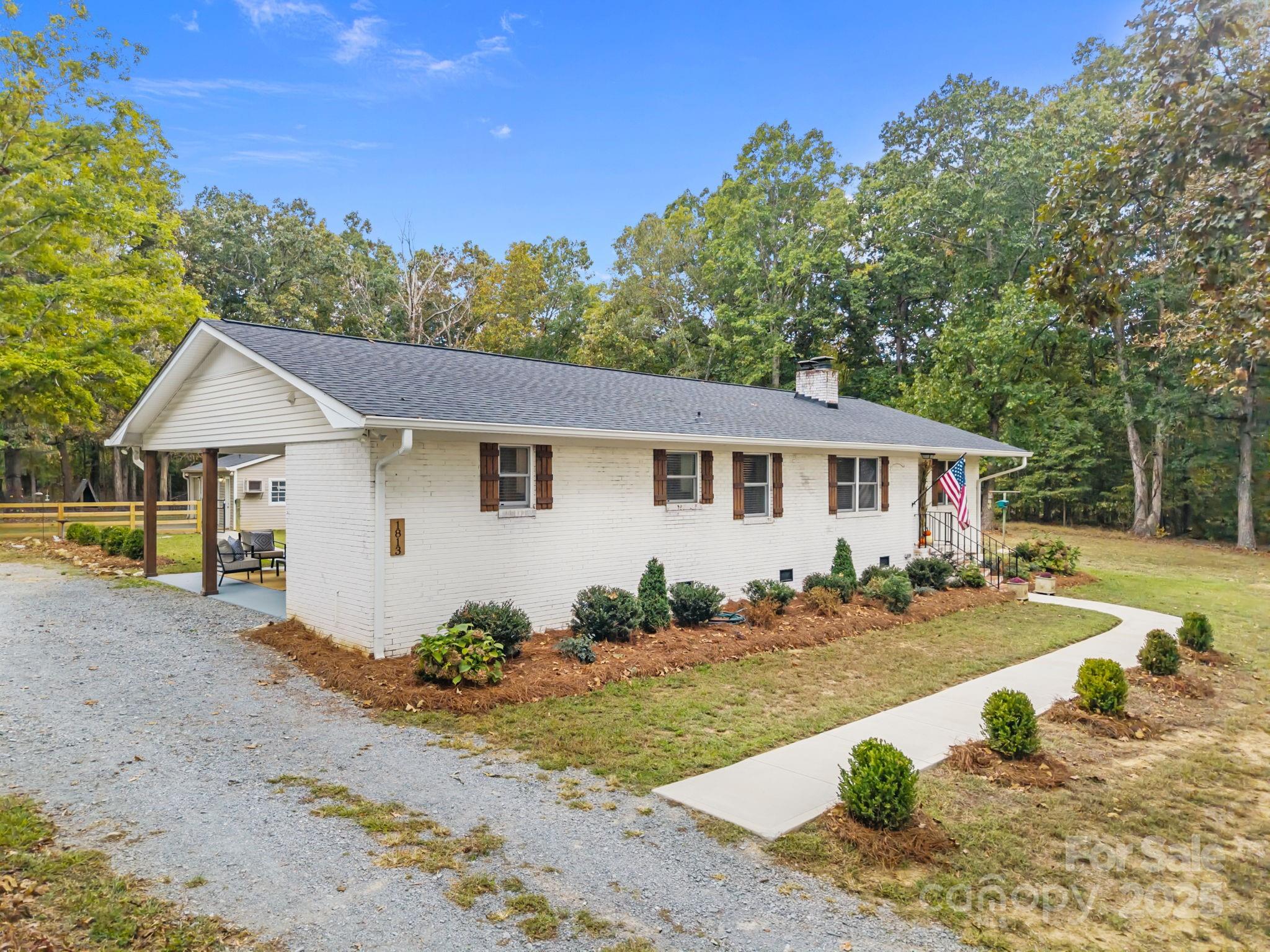 1813 Doster Road Monroe, NC 28112 - Photo 35 of 47 a view of a house with snow on the background