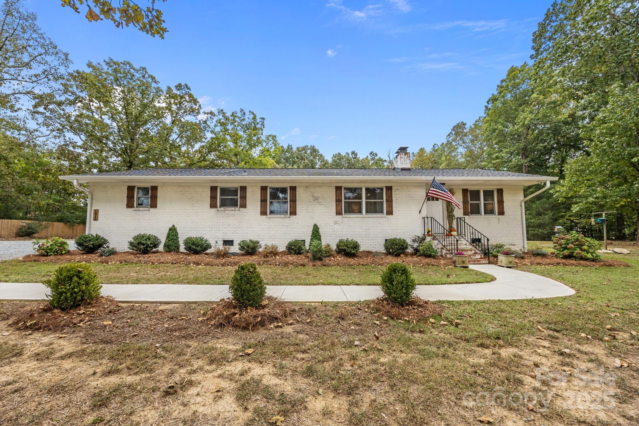 1813 Doster Road Monroe, NC 28112 - Photo 36 of 47 a view of a house with backyard and sitting area