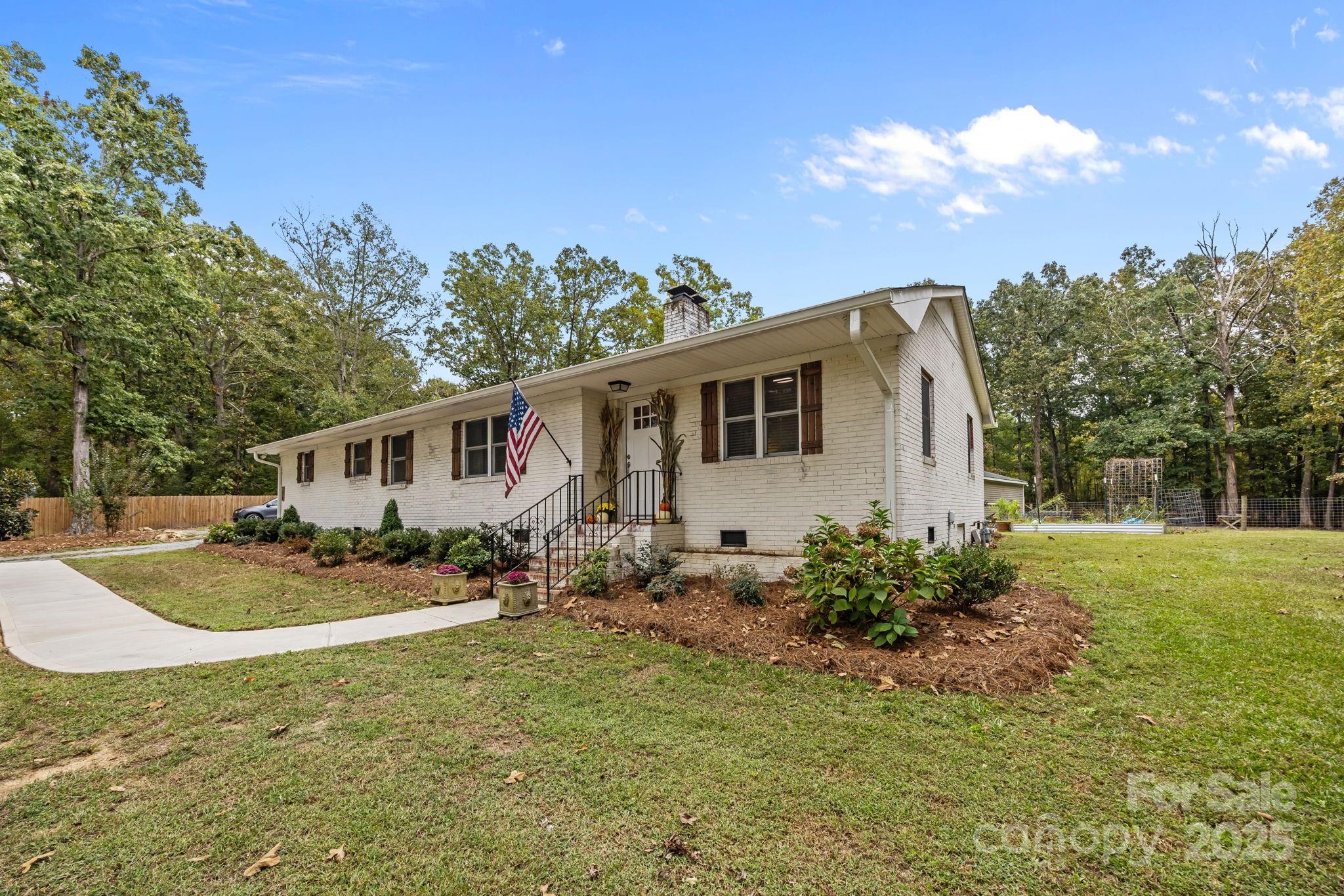 1813 Doster Road Monroe, NC 28112 - Photo 38 of 47 a view of a house with a yard