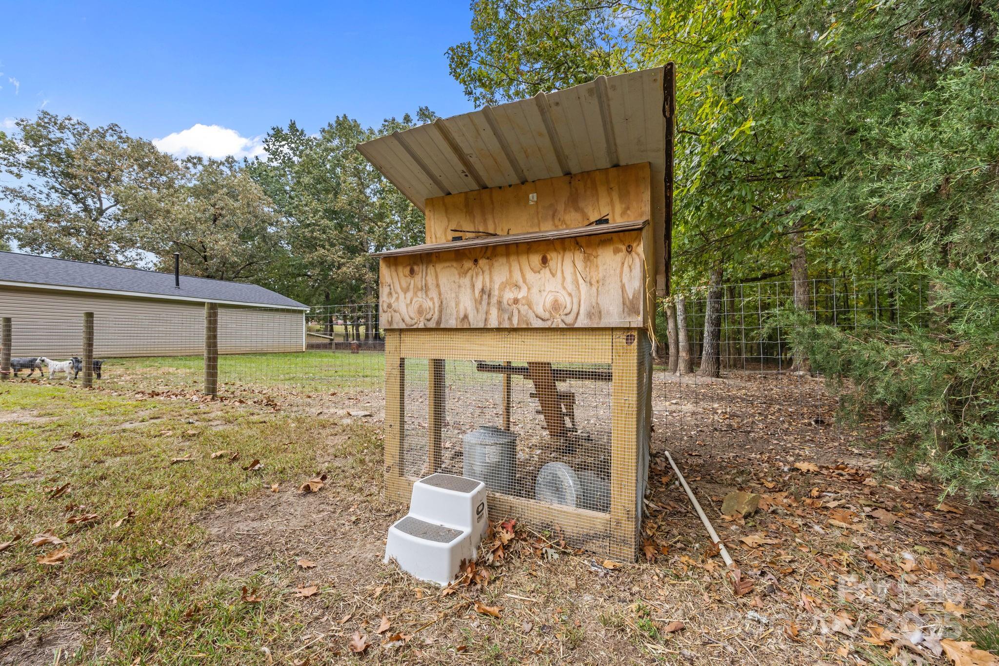 1813 Doster Road Monroe, NC 28112 - Photo 40 of 47 a view of a chair and table in backyard of the house