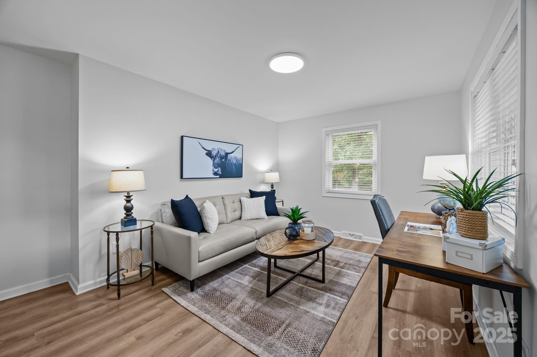 1813 Doster Road Monroe, NC 28112 - Photo 4 of 47 a living room with furniture and a potted plant