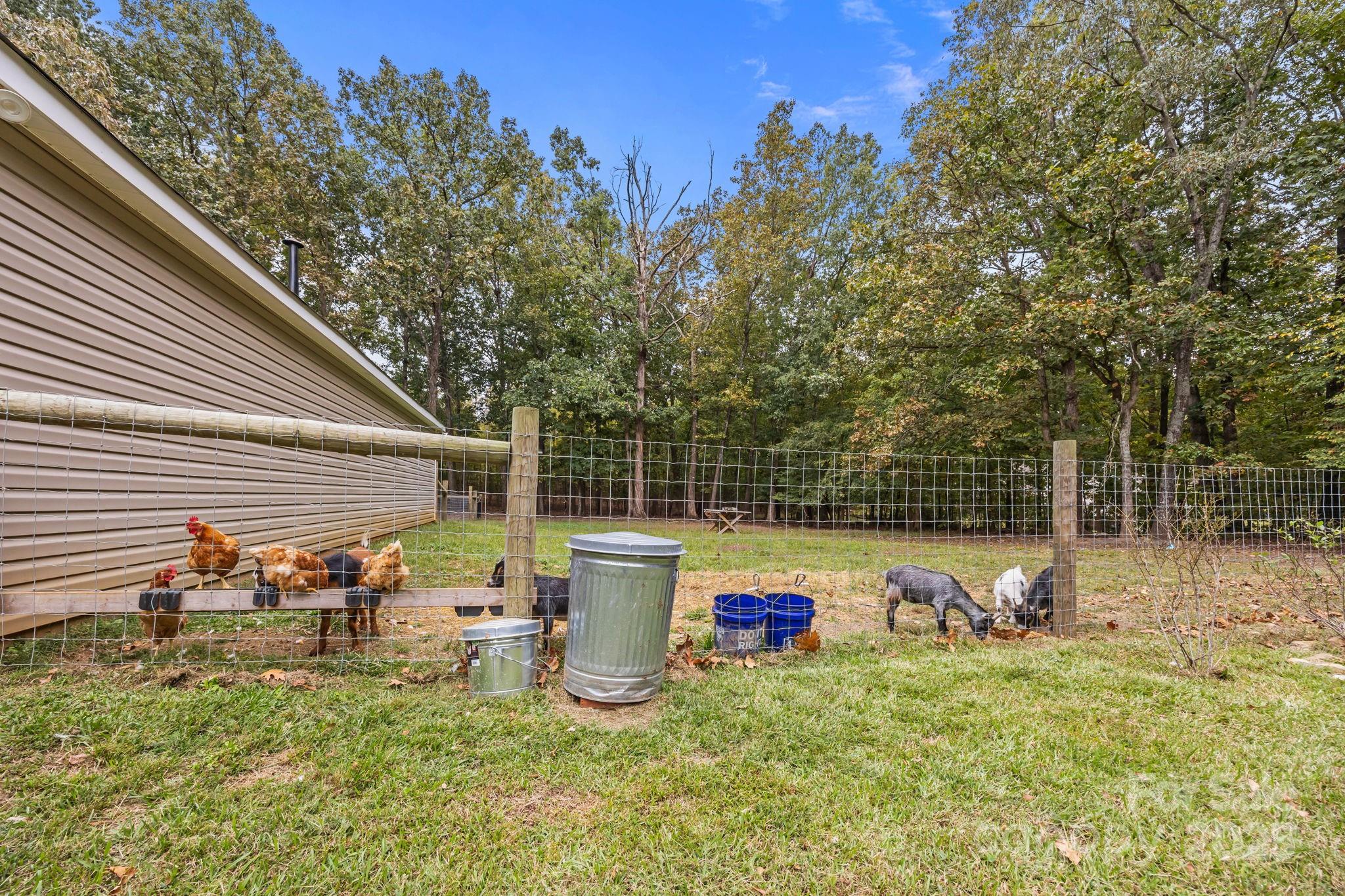 1813 Doster Road Monroe, NC 28112 - Photo 41 of 47 a backyard of a house with table and chairs