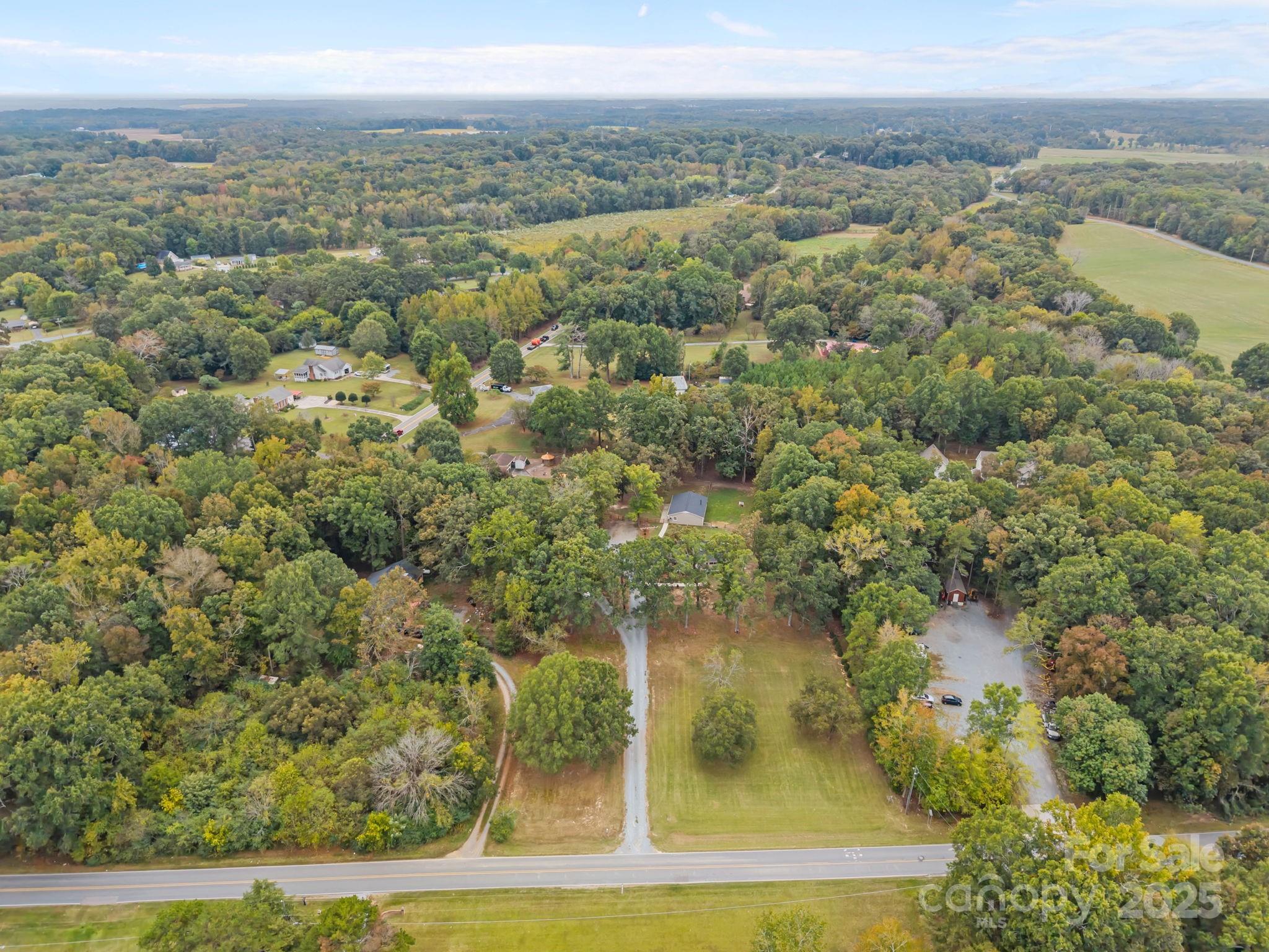 1813 Doster Road Monroe, NC 28112 - Photo 47 of 47 an aerial view of residential houses with outdoor space