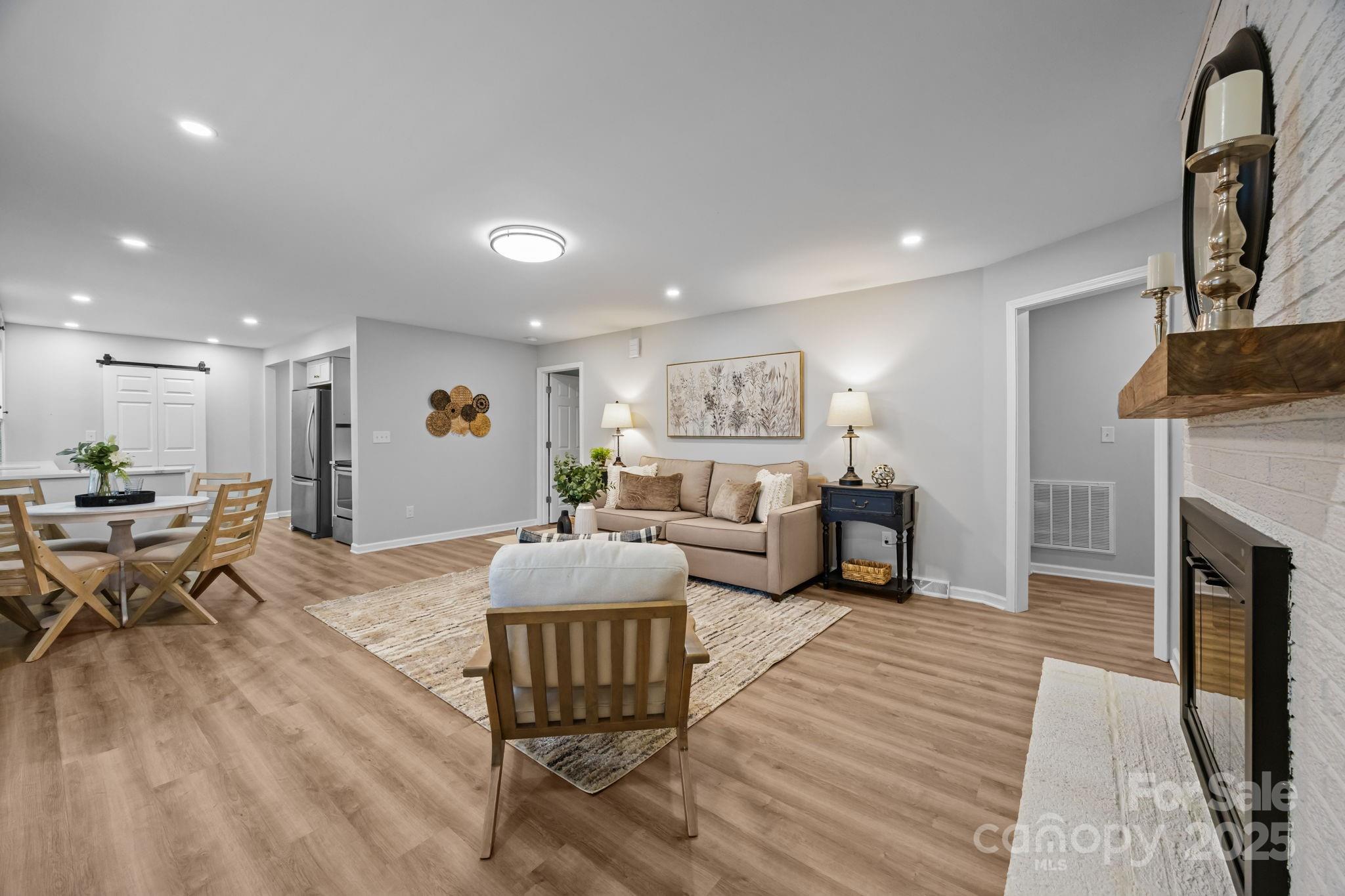 1813 Doster Road Monroe, NC 28112 - Photo 6 of 47 a living room with furniture and a fireplace