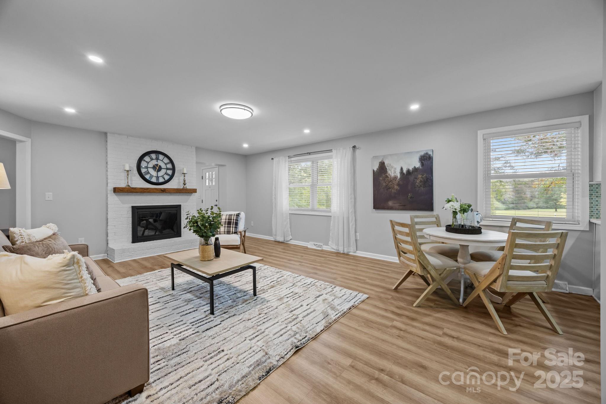 1813 Doster Road Monroe, NC 28112 - Photo 7 of 47 a living room with furniture and a wooden floor