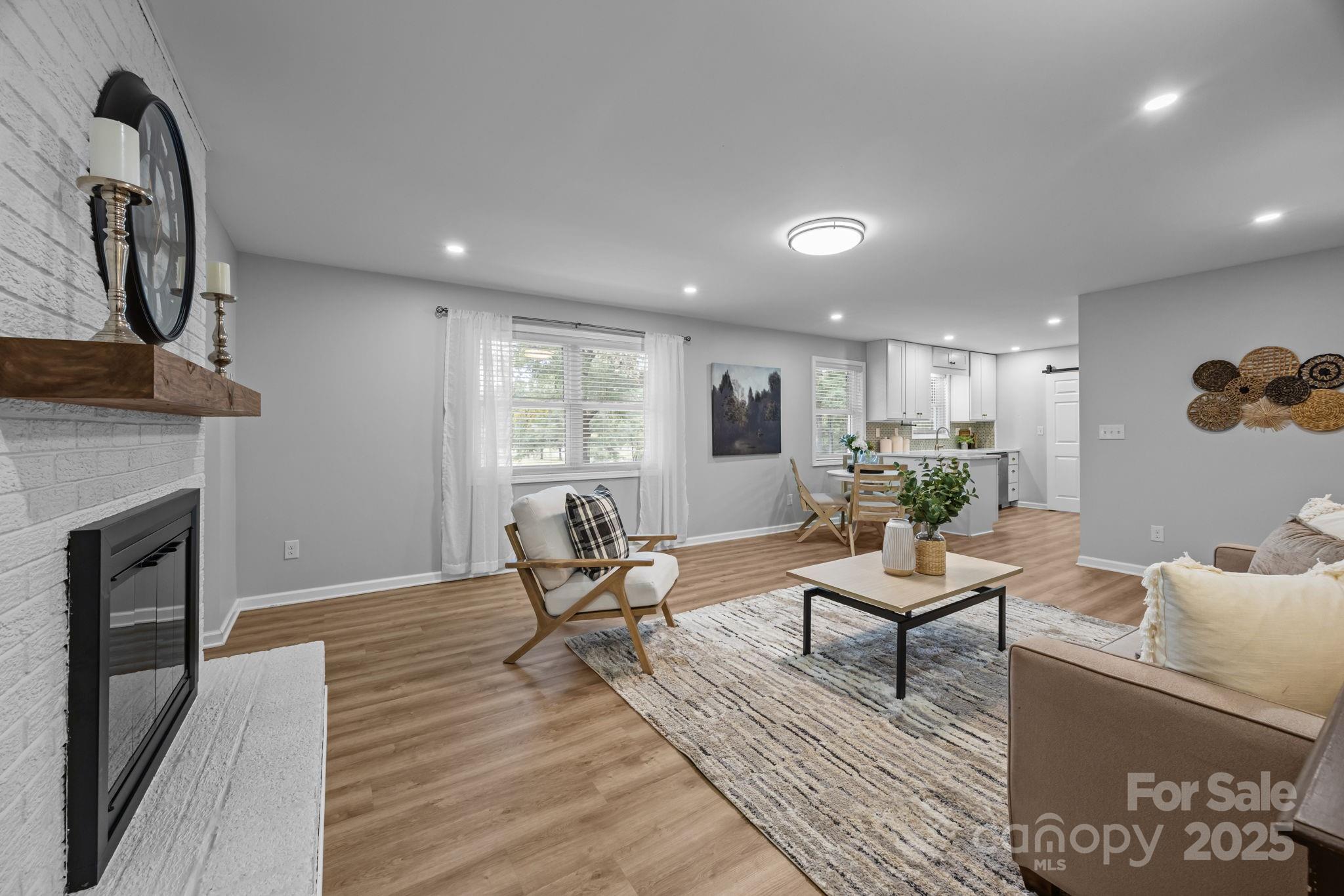 1813 Doster Road Monroe, NC 28112 - Photo 8 of 47 a living room with furniture and a fireplace