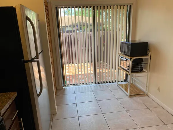 a view of a storage & utility room with a window