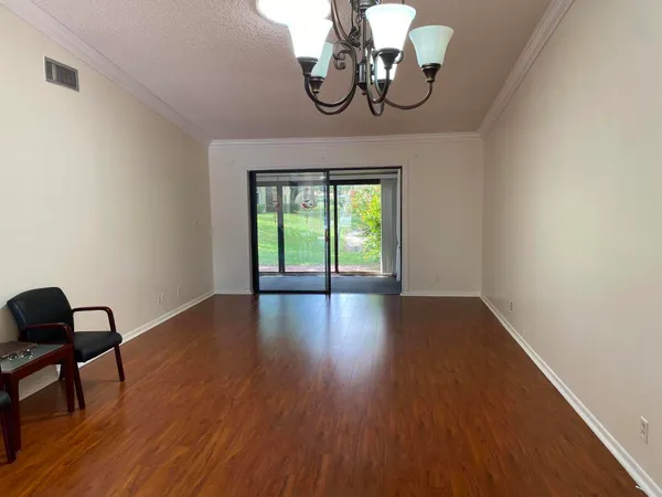a view of a livingroom with furniture and wooden floor