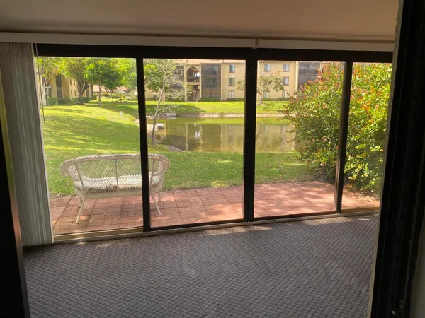 a view of a room with a large window
