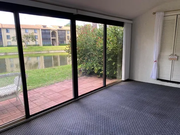 a view of a room with large windows
