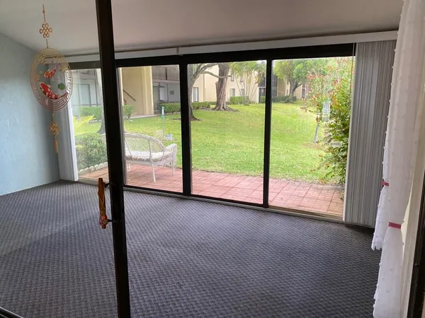 a view of a porch with a backyard